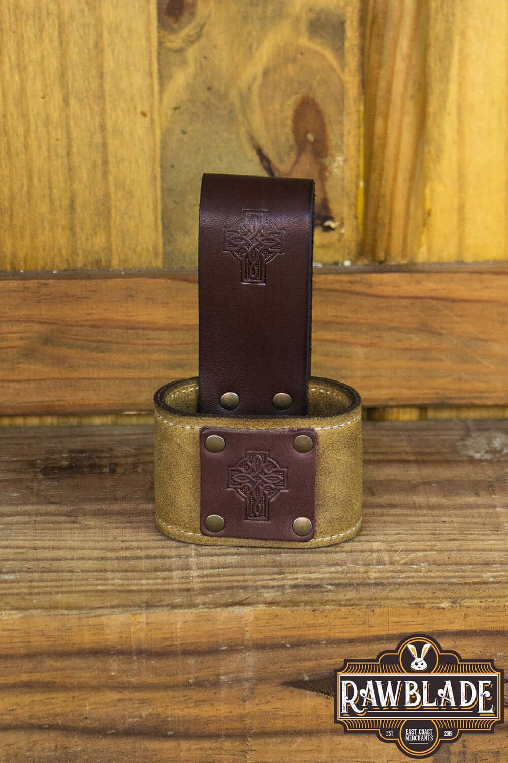 Wanderer Holder featuring engraved leather and Celtic designs, measuring 9cm by 12cm with rivets.