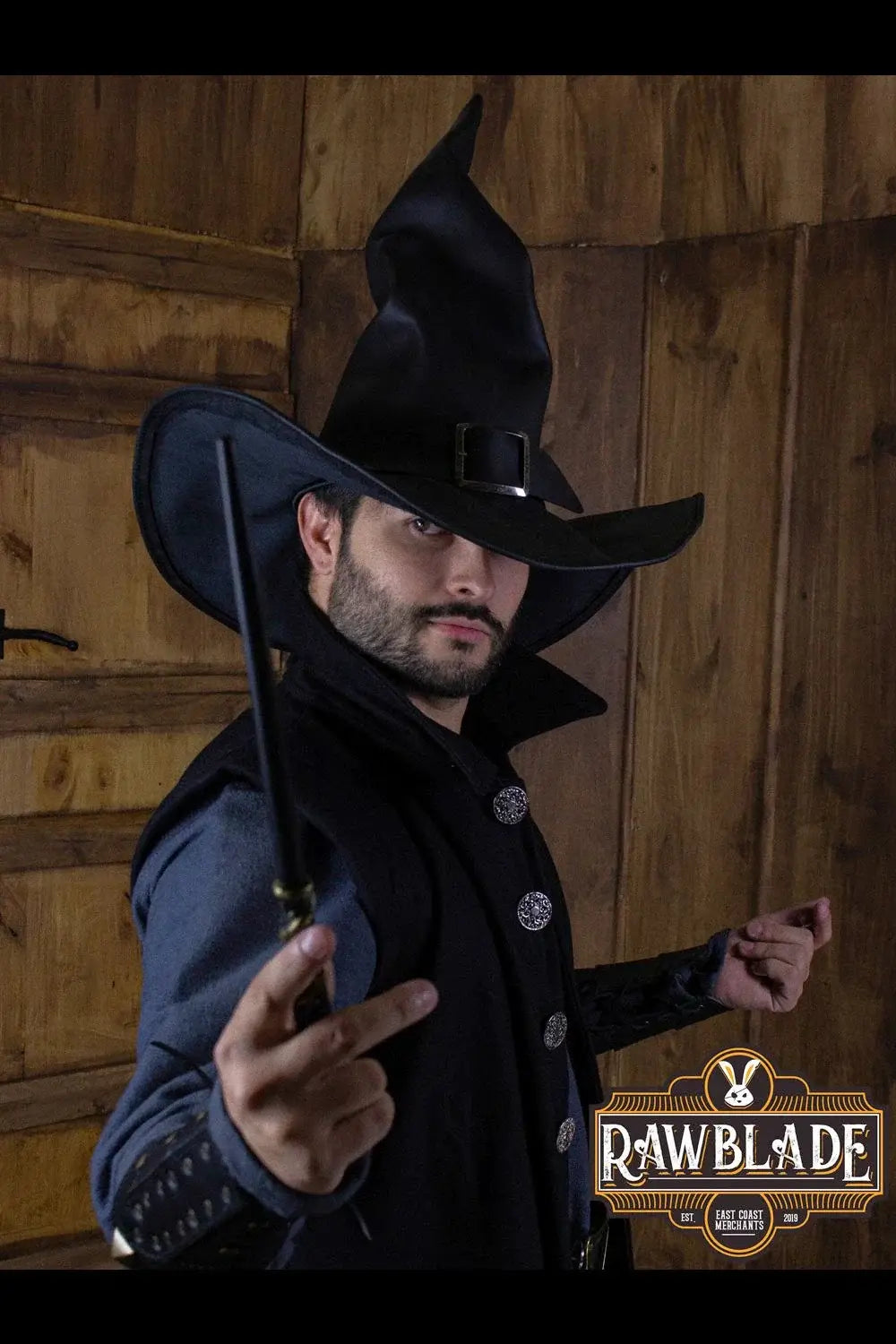 Wikka The Witch Hat worn by a man, showcasing black leather material and molded wings.